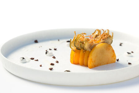 Millefeuille of potatoes and artichokes with yogurt and black garlic by Chef Dalicandro, Rome